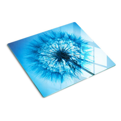 Glass chopping board Dandelion on a blue background