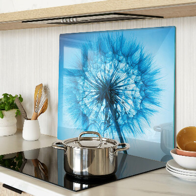 Glass chopping board Dandelion on a blue background