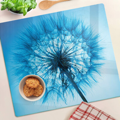 Glass chopping board Dandelion on a blue background