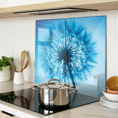 Glass chopping board Dandelion on a blue background