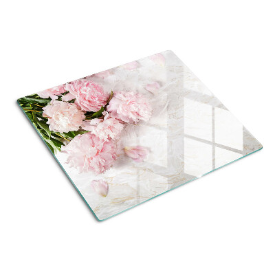 Glass kitchen board Peony flowers on a marble background