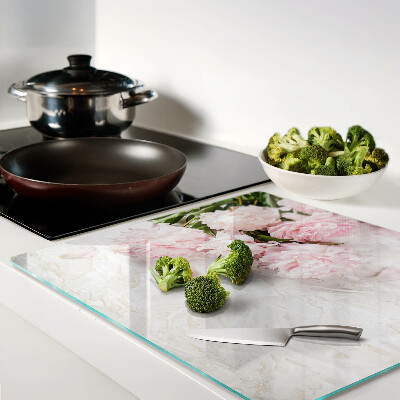 Glass kitchen board Peony flowers on a marble background