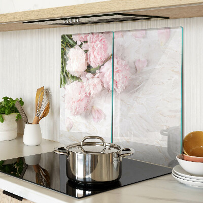 Glass kitchen board Peony flowers on a marble background