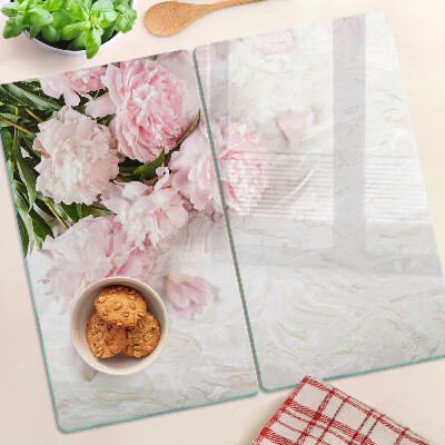 Glass kitchen board Peony flowers on a marble background