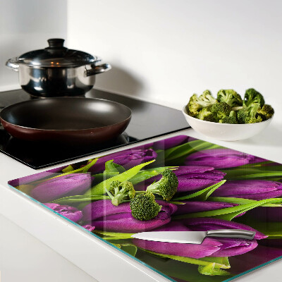 Glass kitchen board Purple tulips with green leaves