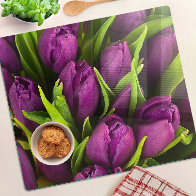 Glass kitchen board Purple tulips with green leaves