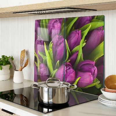 Glass kitchen board Purple tulips with green leaves
