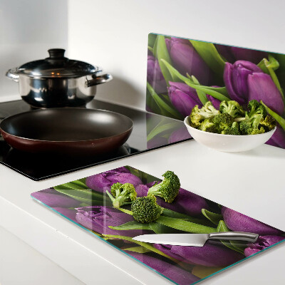 Glass kitchen board Purple tulips with green leaves