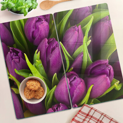 Glass kitchen board Purple tulips with green leaves