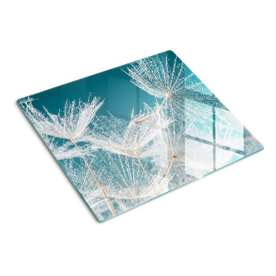 Glass chopping board Dandelions on a blue background