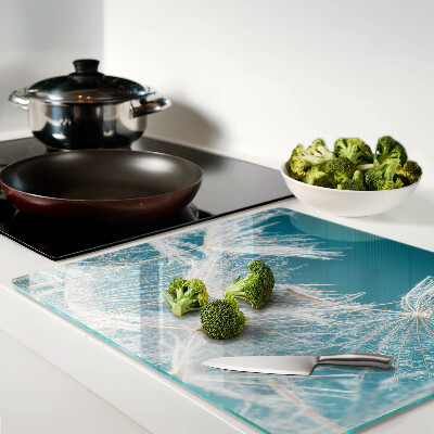 Glass chopping board Dandelions on a blue background