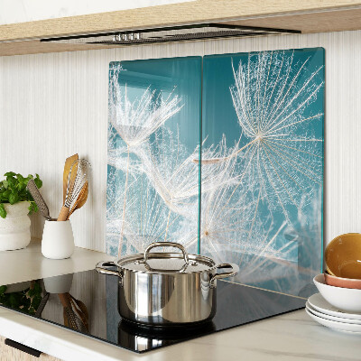 Glass chopping board Dandelions on a blue background