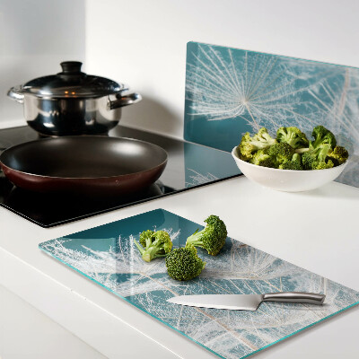 Glass chopping board Dandelions on a blue background