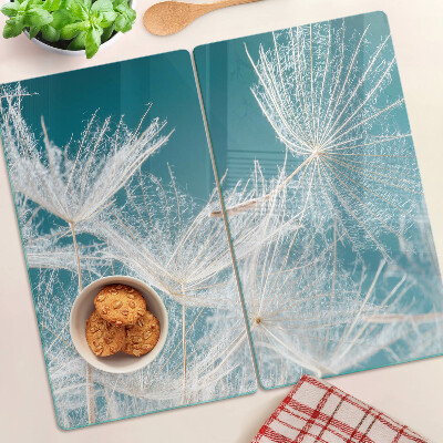 Glass chopping board Dandelions on a blue background