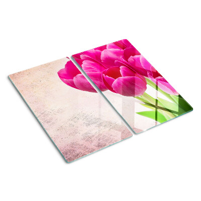 Glass kitchen board Tulip flowers on a pink background