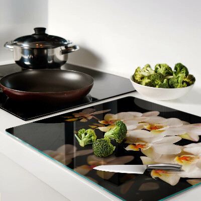Glass chopping board Orchids on a black background