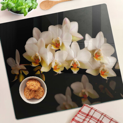 Glass chopping board Orchids on a black background