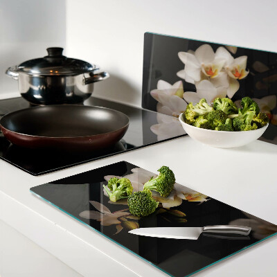Glass chopping board Orchids on a black background
