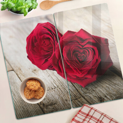 Glass kitchen board Red roses on a wooden background