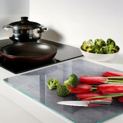 Glass kitchen board Tulips on a gray background