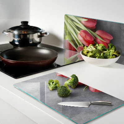 Glass kitchen board Tulips on a gray background