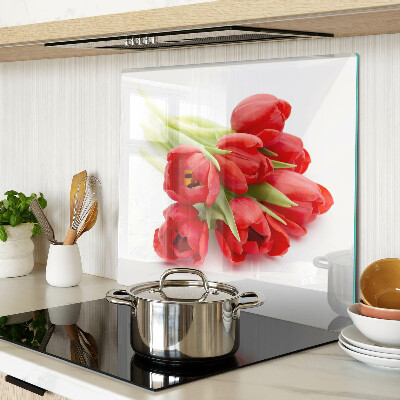 Glass kitchen board Red tulips on a white background