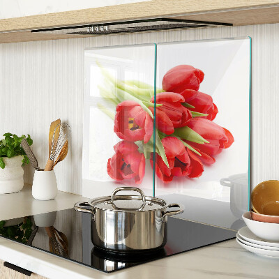 Glass kitchen board Red tulips on a white background