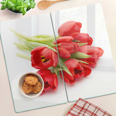 Glass kitchen board Red tulips on a white background