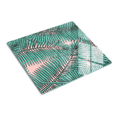 Glass kitchen board Palm leaves on a pink background