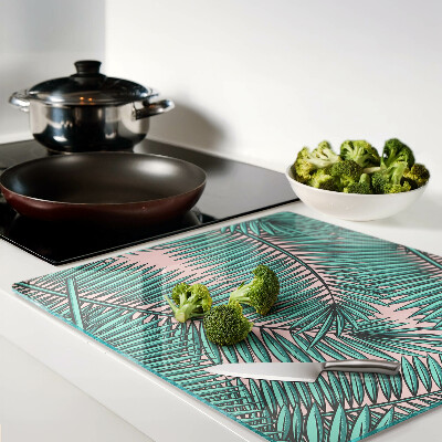 Glass kitchen board Palm leaves on a pink background