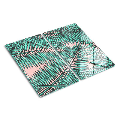 Glass kitchen board Palm leaves on a pink background