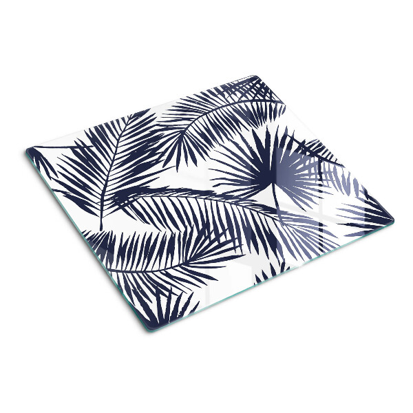 Glass chopping board Palm leaves on a white background