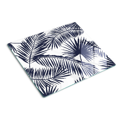 Glass chopping board Palm leaves on a white background
