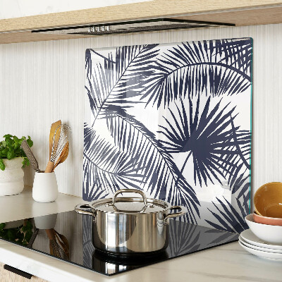 Glass chopping board Palm leaves on a white background