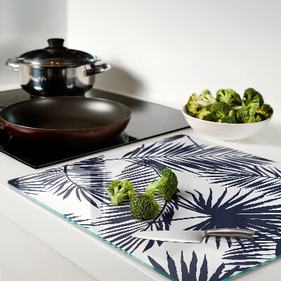 Glass chopping board Palm leaves on a white background