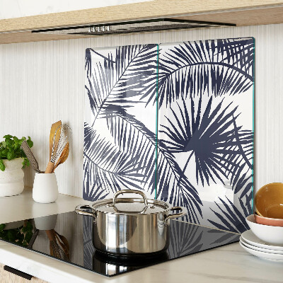 Glass chopping board Palm leaves on a white background