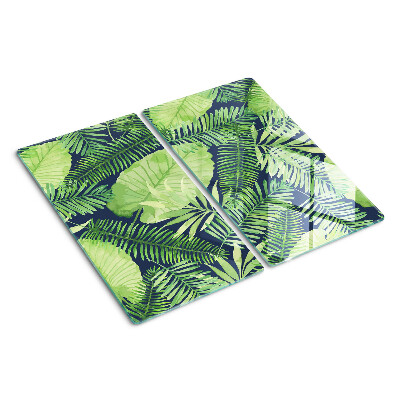 Glass chopping board Tropical leaves on a dark background