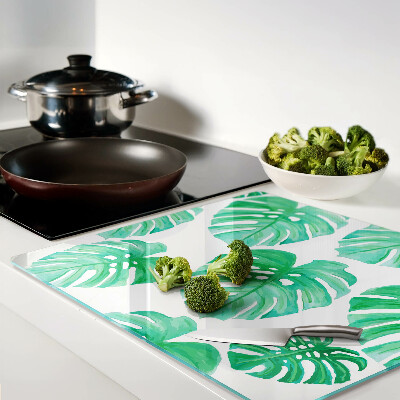 Glass kitchen board Monstera leaves on a white background