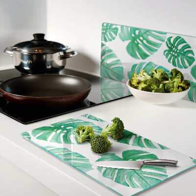 Glass kitchen board Monstera leaves on a white background