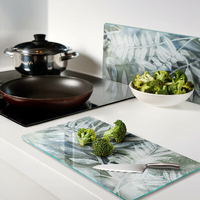 Glass kitchen board Tropical leaves in pastel shades
