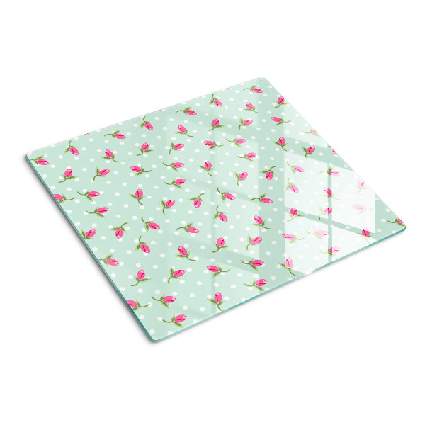 Glass kitchen board Pink tulips on a green background