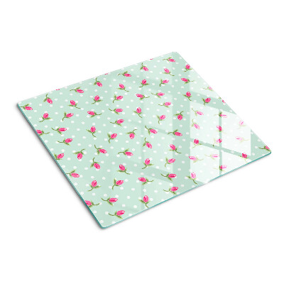 Glass kitchen board Pink tulips on a green background