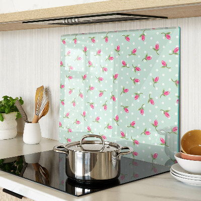 Glass kitchen board Pink tulips on a green background