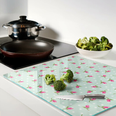 Glass kitchen board Pink tulips on a green background