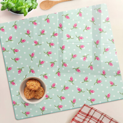 Glass kitchen board Pink tulips on a green background