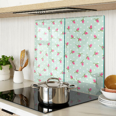 Glass kitchen board Pink tulips on a green background