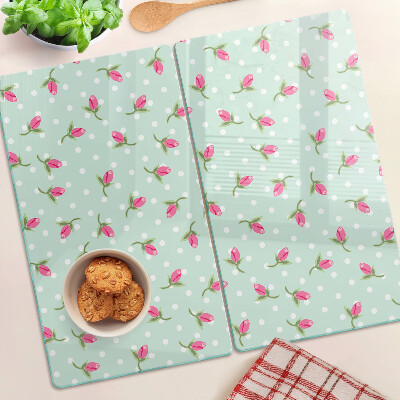 Glass kitchen board Pink tulips on a green background