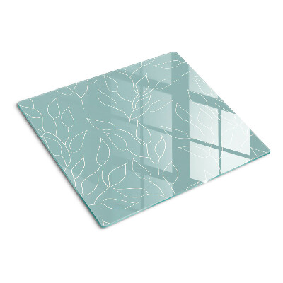 Glass chopping board Leaves on the background
