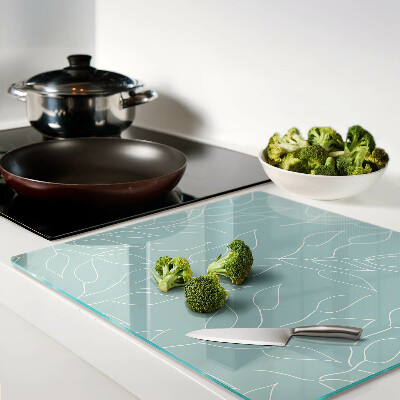 Glass chopping board Leaves on the background