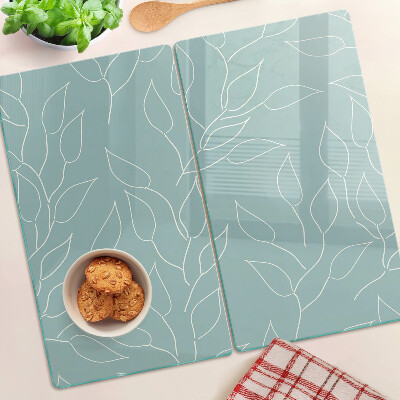 Glass chopping board Leaves on the background